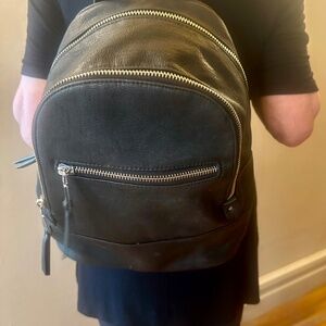 MMS black leather backpack/purse.